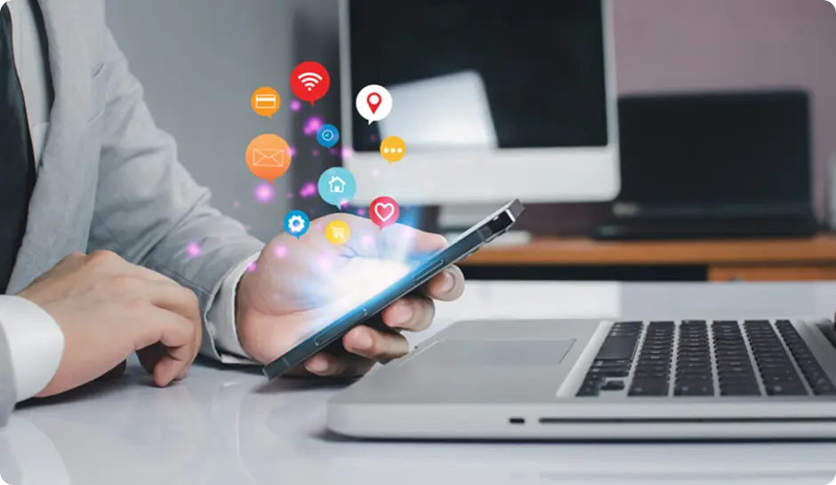 A professional using a smartphone with floating social media icons, symbolizing digital connectivity and communication.